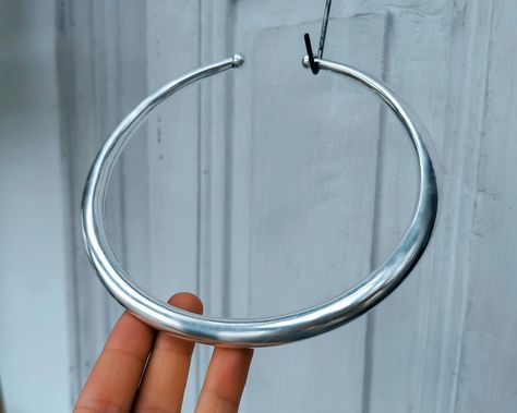 Chunky and thick torque design showcases a bold, gothic-inspired style, perfect for those seeking a unique and daring piece of jewelry. This choker is plated in 925 sterling silver with 5 microns thickness. Nickel and lead free. * The model matches it with these fabulous earrings: https://www.etsy.com/listing/271868454 * Also available in gold brass: https://www.etsy.com/listing/784475940 ✔️ Jewelry protected with e-coat technology. Innovative technique using an electric current to protect your Chunky Silver Choker, Jewelry Goals, Chunky Silver Jewellery, Torque Necklace, Etsy Wishlist, Chunky Silver Necklace, Silver Choker Necklace, Silver Choker, Wishful Thinking