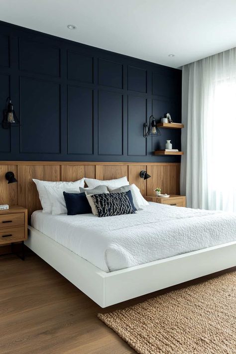 63 Stunning Navy Blue Bedroom Ideas (That Designers Love) Wood And Navy Bedroom, Navy Wood Bedroom, Navy Wainscoting Bedroom, Navy Blue And Wood Bedroom, Bedrooms With Navy Accent Wall, Minimalist Bedroom Navy Blue, Masculine Master Bedrooms Decor, Dark Blue Feature Wall Bedroom, Navy And Brown Bedroom