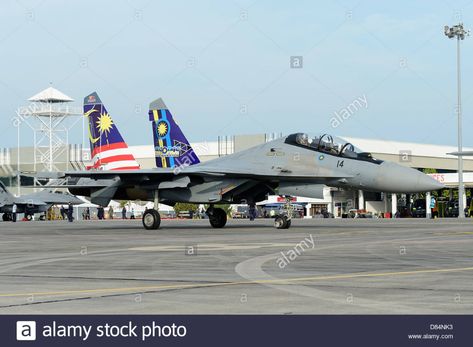 March 31, 2013 - A Sukhoi Su-30 (special colors) of the Royal Malaysian Air Force taxiing at Langkawi Airport, Malaysia. Stock Photo Sukhoi Su 30 Malaysia, Malaysia Airport, Royal Malaysian Air Force, People In The Background, Sukhoi Su 30, Under The Sea Animals, Al Qadr, Fighter Planes Jets, Special Colors