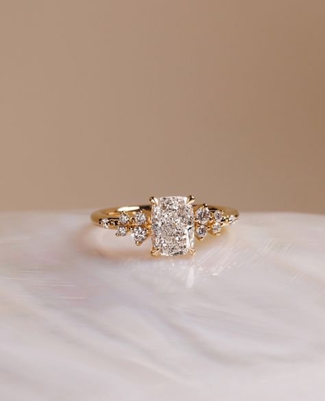 Elongated Cushion with accent stones? YES PLEASE✨⁠
⁠
The gorgeous Winnie engagement ring💍⁠
⁠
Would you say yes to this beauty? ⁠
⁠
Details:⁠
Winnie - Elongated Cushion with Accent Stones
1.50cts | E | VVS2 Wedding Rings Elongated Cushion, Elongated Cushion With Side Stones, Cushion Engagement Ring Gold, Ring Cuts, Most Popular Engagement Rings, Ring Inspo, Popular Engagement Rings, Elongated Cushion, Engagement Ring Photos