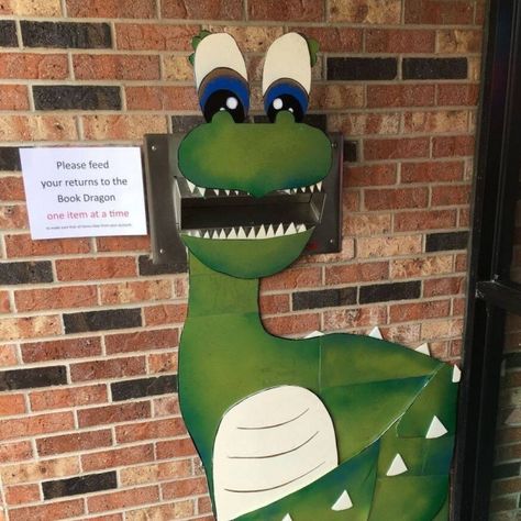 Library Book Drop, Library Book Return Ideas, Dinosaur Window Display, Dinosaur School Display, Dinosaur Library Display, June Library Displays, School Library Book Displays, Library Boards, Library Book Displays