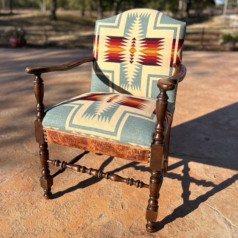 I've been staring at this chair in my house for five years. Just the frame, no old fabric to tell me about its history. It "came with the house," out of attic after my grandparents passed. When we took the western upholstery workshop In October, I wanted to work on a piece that I could keep for myself, and this was a great project. A little Pendleton, a little croc-embossed leather, and check out our West Riley brand (x2!) on the frame. I'm definitely keeping this one :) Arizona Christmas, Farm Furniture, Upholstery Workshop, Western Chair, Western Living Room, Church Pew, Western Furniture, Redo Furniture, Ranch Style