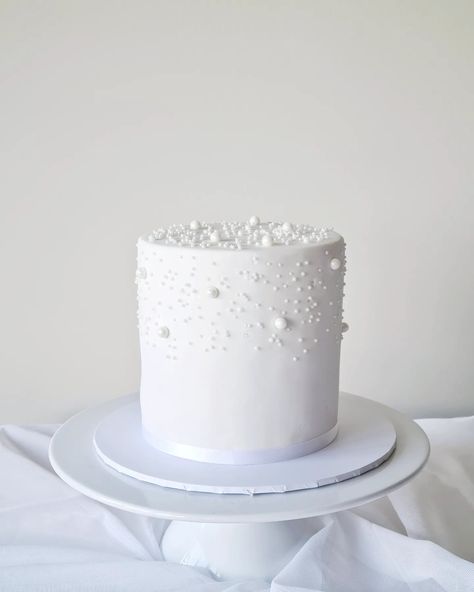 White cake with pearls decorations 🤍🤍 {Engagement} #whitecake #whitefondantcake #engagementcake #engagementparty #engagament #whitecake #yarraville #maidstone #footscray #westfootscray #kingsville #seddon #tottenham #pointcookcakes #pointcook #sanctuarylakes Engagement Cake With Pearls, White And Silver Engagement Cake, White Cake With Pearls Simple, White Cake With Pearls, Simple White Wedding Cake Pearls, 2 Tier Wedding Cakes Pearl, White Fondant Cake, Elegant Wedding Cake Toppers, Pearl Decorations