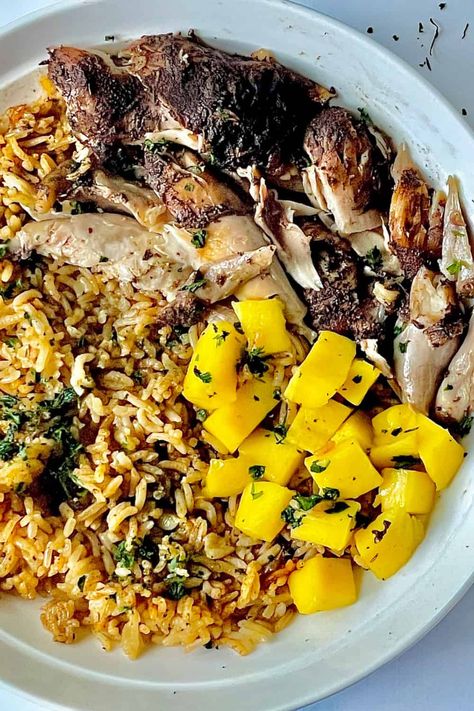 This delicious Instant Pot Jerk Chicken and Rice is full of authentic Jamaican flavor. It's an easy, full meal made in one pot. Make this as a complete dinner topped with sweet mango and crisp cilantro. Everything pressure cooks together, and the chicken becomes fall apart tender. This spicy meal is made with jerk seasoning and scotch bonnet powder for true Jamaican taste. via @Tastyovenlovin Jerk Chicken Instant Pot, Jamacian Jerk Chicken, Pressure Cooker Recipes Vegetarian, Jerk Chicken With Pineapple Salsa, Instant Pot Jerk Chicken, Jerk Chicken With Pineapple, Chicken With Pineapple Salsa, Jerk Chicken Marinade, Jerk Chicken And Rice