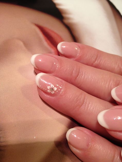 french gel nails flower design French Tip Nails With Small Flowers, Gel Nails Flower Design, Flower Ring Finger Nails, White French Tip Nails With Flower On Ring Finger, French Tip With Flower On Ring Finger, Flower On Ring Finger Nail, Nails Flower Design, French Gel Nails, Manicure Pictures