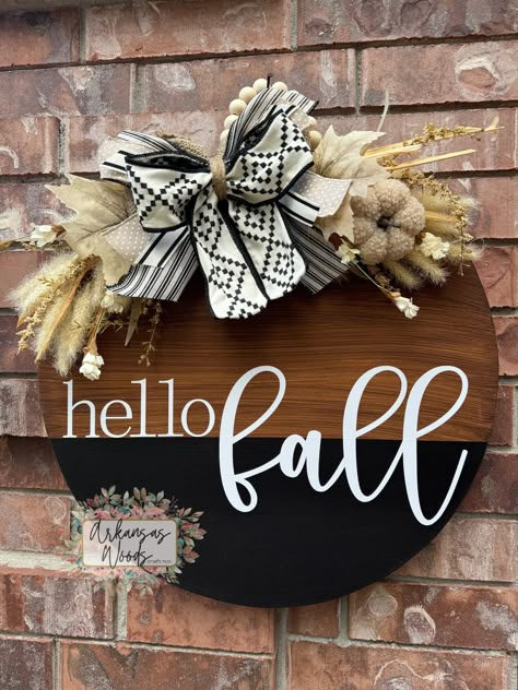 Wanting to stay away from the traditional "fall wreath"? Our newest Hello Fall Farmhouse Door Hanger is the perfect route to go! Complete with hand painted detailing, new beautiful textured fall foliage, your choice of wording, and complete with the perfect accent of a boho-inspired bow! This is the perfect staple piece for anyone who loves simple statement pieces, boho inspired, farmhouse-style decor, or beautiful fall foliage to accent any door or porch! >>Select your size to best meet your needs! 18 inch round or 22 inch round.  These are perfect for indoor/outdoor usage!  >> MATERIALS: All of our door hangers are hand designed/cut and made with a high quality 1/2 inch thick MDF wood. This wood will not warp or splinter with time or weather unlike other woods such as plywood. These will Hobby Lobby Pumpkin Door Hanger, Simple Fall Door Hangers, Door Hangers Fall, Boho Fall Door Hangers, Fall Wood Door Hangers, Simple Fall Decor Front Doors, Autumn Door Hangers, Hello Fall Door Hanger, Fall Door Signs