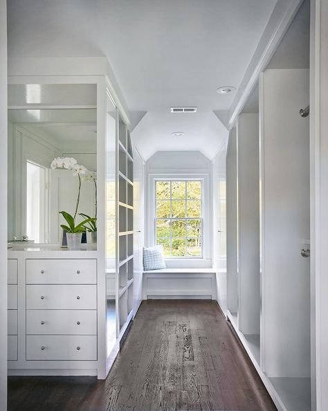 White walk in closet features a nook filled with a built-in dresser with inset drawers under a mirror facing a wall of stacked tension rod clothes rails. Closet Window, Built In Window Seat, Master Closet Design, Window Bench Seat, Built In Dresser, Closet Built Ins, Wardrobe Room, Closet Remodel, Dream Closets