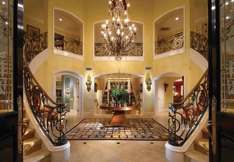 Yellow Foyer, Yellow Mansion, Light Yellow Walls, Brick Archway, The Color Yellow, Huge Wall Art, Wood Plank Flooring, Foyer Ideas, Fancy Table