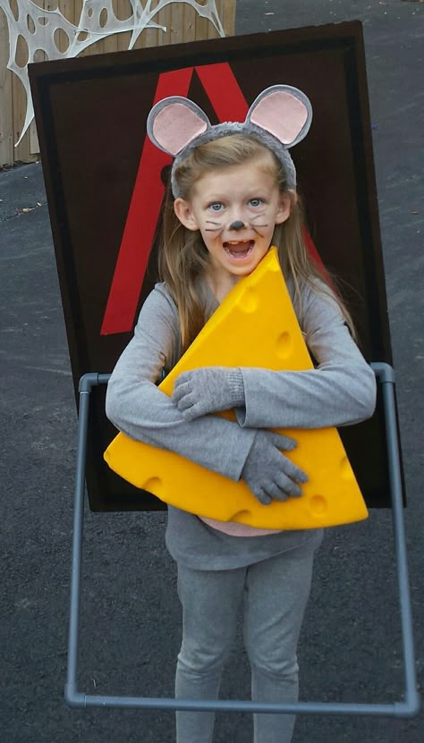 Mousetrap costume. made it with foam board with brown spray paint and red tape, pvc piping with gray spray paint for the trap bar, I bent 2 metal hangers for the strap to hold it on her back, cheese hat and grey clothes and ears. Easy costume to make and Emily won 1st place in 3 different contest. Diy Mouse Costume, Mouse Diy Costume, Kids Mouse Costume, Mouse Costume Diy, Brown Spray Paint, World Book Day Outfits, Cheese Costume, Kids Dress Up Costumes, Last Minute Kostüm