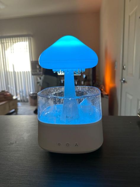 This mushroom cloud-shaped lamp functions as a humidifier and includes essential oils. I enjoy falling asleep with the rain setting on Mouth Wash Dispenser, Mouthwash Dispenser, Mouth Wash, Mushroom Cloud, Cloud Lamp, Rain Clouds, Cozy Room Decor, Lotion Dispenser, Mouthwash