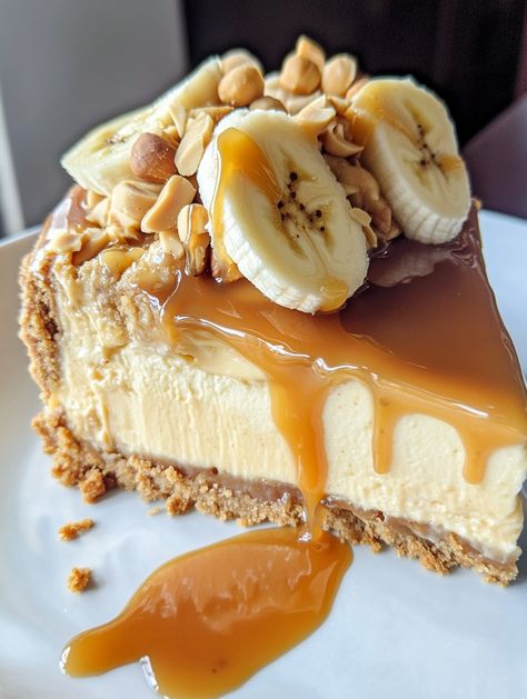 Banana Caramel Peanut Butter Cheesecake 🥜

🍌 𝗜𝗻𝗴𝗿𝗲𝗱𝗶𝗲𝗻𝘁𝘀 🍌
For the Crust:
1 1/2 cups graham cracker crumbs 🍪
1/4 cup unsalted butter, melted 🧈
For the Cheesecake Filling:
3 cups cream cheese, softened 🧀
1 cup granulated sugar 🍬
1 cup smooth peanut butter 🥜
1 teaspoon vanilla extract 🍦
3 large eggs 🥚
1/2 cup heavy cream 🥛
For the Caramel Layer:
1 cup granulated sugar 🍬
6 tablespoons unsalted butter, cubed 🧈
1/2 cup heavy cream 🥛 Peanut Butter Banana Cheesecake, Chocolate Covered Strawberry Cake, Cheesecake Ingredients, Banana Cream Cheesecake, Banana Caramel, Smooth Peanut Butter, Banana Cheesecake, Cheesecake Mousse, Cream Cheese Muffins