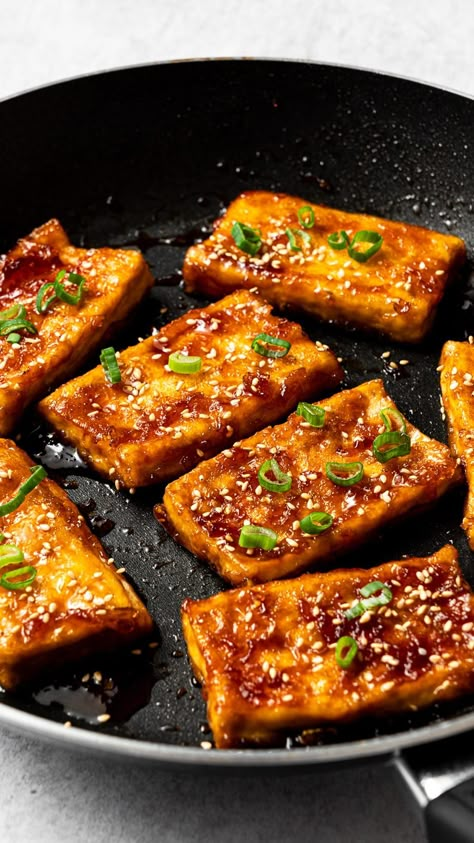 This teriyaki tofu is a delicious combination of pan-seared tofu slices and sweet and savory teriyaki sauce. Serve it alongside a bowl of fluffy white rice and your favorite vegetable sides for a quick and healthy dinner that will convert anyone into a tofu lover! Crispy Teriyaki Tofu And Avocado Rice Stack, Teriyaki Tofu Sandwich, Teriyaki Tofu Bowl, Tofu Aesthetic, Tofu Side Dish, Tofu Rice Bowl, Tofu And Rice, Easy Dinner For One, Low Carb Meal Prep Ideas