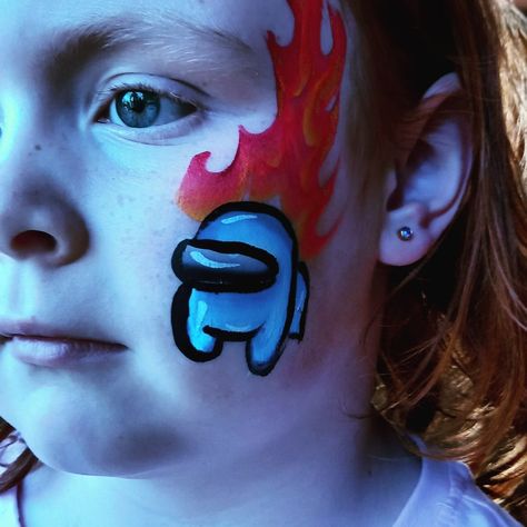 Among Us face paint Face Painting Among Us, Video Game Face Paint, Face Painting Ideas For Kids Boys, Fortnite Face Paint, Among Us Face Paint, Face Painting Ideas For Boys, Easy Face Painting Designs, Diy Face Paint, Cool Face Paint