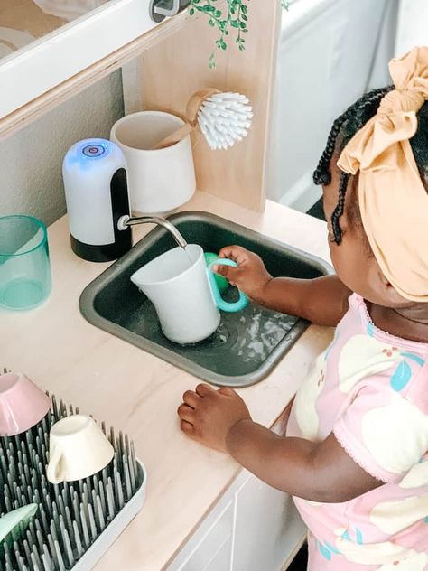 Play kitchens are a staple in almost every household, but if you want to take things up a notch, try making a functional toddler kitchen, it's easier than you Ikea Toy Kitchen Hack Montessori, Montessori Ikea Kitchen Hack, Ikea Play Kitchen Running Water Hack, Play Kitchen With Running Water, Play Kitchen Upgrade, Ikea Play Kitchen Hack Functional, Kids Ikea Kitchen Hack, Ikea Functional Play Kitchen, Kids Functional Kitchen