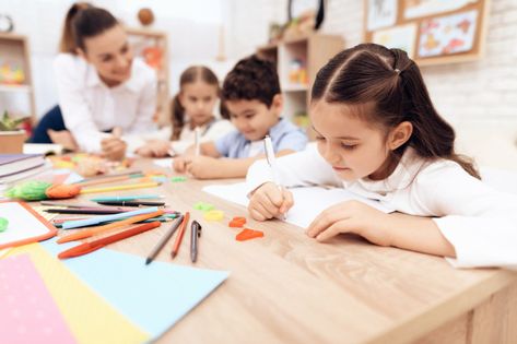 Children write in notebooks with a pen. | Premium Photo #Freepik #photo Children Writing, Teacher Development, Photo School, School Photographer, Children Education, School Admissions, Overseas Education, Nursery School, Educational Consultant