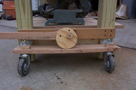 The levers turn a cam that pushes down on the caster board. The whole thing is very simple. The lever lifts the bench extremely easy and there is no noticable flexing, do to stress, on the oak boards. Daryl on woodworkingtalk.com Workbench Wheels, Retractable Wheels, Workbench On Wheels, Retractable Casters, Workbench Casters, Build Your Own Garage, Caster Board, Workbench Ideas, Diy Workbench