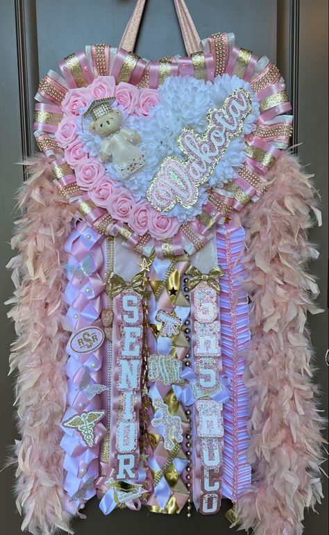 Mum Homecoming Senior, Wrestling Homecoming Mum, Mums Homecoming Junior Year, Senior Hoco Mums Pink, Pink And Gold Mums Homecoming, Pink And Gold Homecoming Mum, Hoco Mums Ideas Senior, Junior Year Homecoming Mum, Pink Hoco Mum