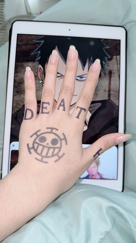 law hand tattoo one piece trafalgar law tattoo Tato Law, Laws Hand Tattoo, Law Tattoo One Piece Hand, Law One Piece Hand, Anime Hand Tattoo Ideas, Trafalgar Law Hand Tattoo, Laws Tattoos One Piece, One Piece Hand Tattoo, Trafalgar Law Hands