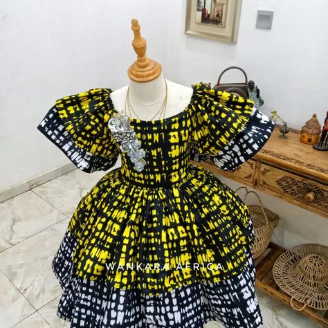 Two Ankara fabrics ,one dress ! How do you like this off shoulder dress ... Kampala Styles For Kids Girl, Ankara For Children, Ankara For Kids Girls Dresses, Children Gowns Dresses Nigeria, Children Gowns Dresses Ankara, Kids Ankara Styles Children, Children Ankara Gown Styles, Latest Children Ankara Gown, Ballas Gang