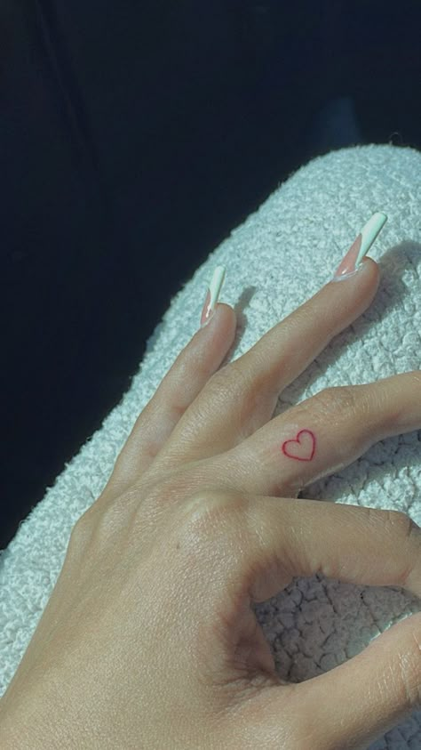 Micro Red Heart Tattoo, Red Heart Hand Tattoo, Fine Line Red Heart Tattoo, Red Ink Tattoos Fine Line, Micro Heart Tattoo Finger, Heart Shaped Tattoo Ideas, Red Ink Finger Tattoo, Fine Line Red Tattoo, Red Heart Finger Tattoo