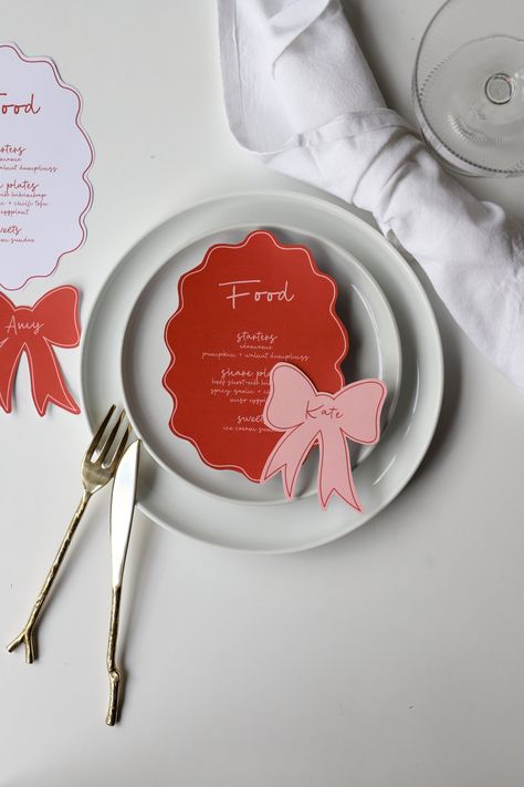 Blush pink menu & bow place card templates | pink and red hens bachelorette party, wavy border menu, hand drawn bow place cards, handwritten menu wavy border dinner menu, pink and red bow shaped place cards  Elevate Your Event with Effortless Elegance  Our editable templates are not just an invite, a menu or a sign; they are a statement piece that sets the tone for an unforgettable soirée. Designed with impeccable aesthetics and convenience in mind, our templates are a must-have for every modern Friendsmas Dinner Table Settings, Vmfa Wedding, Red And Pink Party, Pink And Red Party, Invitation Aesthetic, Pink Bachelorette Party, Red Hen, Place Card Template, Font Types