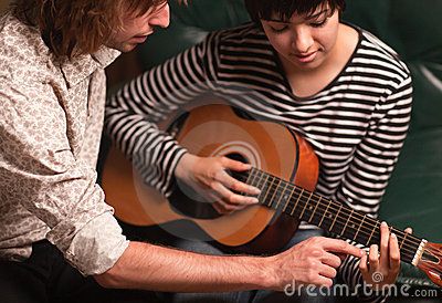 Musician Teaches Female Student To Play The Guita - Download From Over 39 Million High Quality Stock Photos, Images, Vectors. Sign up for FREE today. Image: 19188345 Teaching Guitar, Guitar Lessons For Kids, Guitar Teaching, Types Of Guitar, Guitar Teacher, Guitar Lessons For Beginners, Guitar Practice, Easy Lessons, Guitar Tips