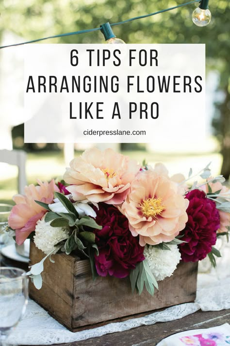 6 Tips For Arranging Flowers like a Pro even if you don't feel like it. You don't have to be a florist or a flower farmer to have beautiful centerpieces. But you will be a good host with them! Your tablescape will be the talk of the night! #tablescapes #dinnerparty #hostingtips #flowerarranging Flower Arrangements Inspiration, Containers For Flower Arrangements, Easy Fall Floral Arrangements, Bouquet Without Flowers, Modern Flower Arrangements Centerpieces, Sanctuary Decor, Floral Mechanics, Floral Workshop, Fake Flower Arrangements