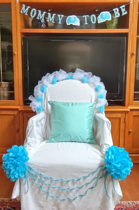 Mom-to-be thrown. Chair draped with a white bed sheet and decor from micheals and joann fabrics. Mother To Be Chair, Mommy To Be Chair Ideas, Baby Shower Chair Ideas, Decorate Chair For Mom To Be, Baby Shower Chairs For Mom And Dad, Baby Shower Mom Chair, Baby Shower Chair For Mom, Baby Shower Opening Gifts Chair, Baby Shower Decorating Ideas