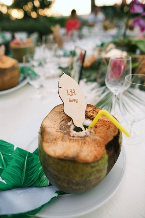 Each seat at this reception featured a drinkable coconut fit with a straw and wooden tropical leaf place card. Wedding Coconut, Summer Reception, Tropical Wedding Theme, Coconut Cups, Coconut Shavings, Wedding To Do List, Coconut Drinks, Fresh Coconut, Ceremony Design