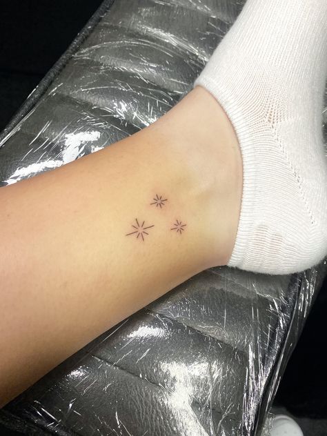 Sparkle Ankle Tattoo, Ankle Tattoo Stars, Ankle Star Tattoo, Star Tattoo Fine Line, Twinkle Star Tattoo, Twinkle Tattoo Stars, Twinkle Tattoo, Sparks Tattoo, Firework Tattoo