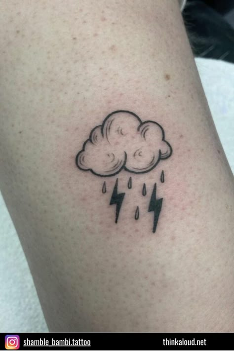 The simplicity of this tattoo is what makes it so special. This isn’t a simple lightning tattoo because there are other elements incorporated into it. It’s a cloud, with rain, and two lightning bolts. You can add whatever meaning you want to this tattoo, but it’s obvious that you’re someone who loves this gloomy weather. Cloud Lightning Tattoo, Rain Cloud Tattoos, Tattoo Daruma, Cloud Tattoo Design, Rain Tattoo, Storm Tattoo, Lightning Bolt Tattoo, Lightning Tattoo, Bolt Tattoo