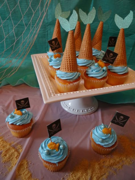 Mermaid and pirates cupcakes Pirate And Mermaid Gender Reveal Party, Mermaid And Pirate Cupcakes, Mermaid Or Fisherman Gender Reveal, Pirates And Mermaids Party, Mermaids And Pirates Party, Mermaid Or Pirate Gender Reveal, Mermaid Gender Reveal, Pirates And Mermaids Birthday Party, Pirates Cupcakes