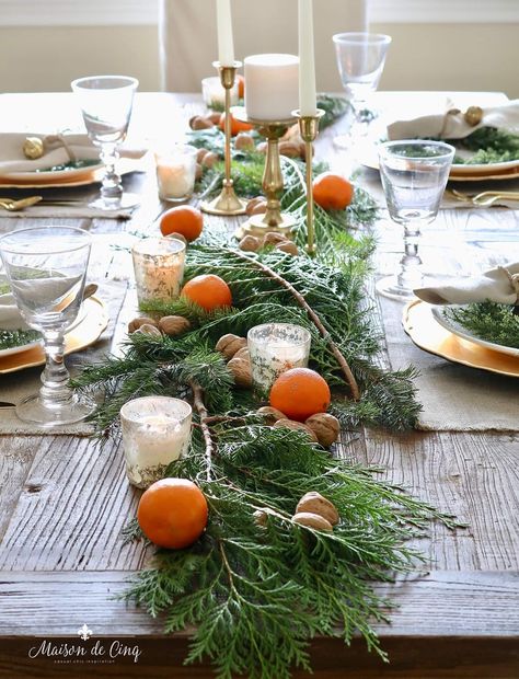 European Inspired Tablescape with Cedar, oranges, and wanut! Cozy Holiday Tablewith natural elements and touches of gold--->#maisondecinq christmastable christmastablescape holidaytable holidaytablescape holidayentertaining christmasdecor tablesetting tablescape europeanstyle europeanchristmas frenchchristmas frenchstyle frenchfarmhouse europeanfarmhouse frenchcountry countryfrench Christmas Dining Table Decor, Christmas Dining Table, Orange Table, Hosting Christmas, Country Christmas Decorations, Holiday Table Settings, Winter Table, Holiday Tablescapes, Cozy Holiday