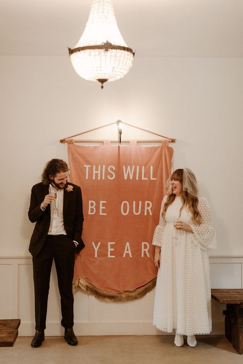 \This Will Be Our Year' - wall hanging wedding sign by creative Alice Gabb. Charlotte Jacklin in 1970's inspired wedding dress. The Curries Photography #thiswillbeouryear #alicegabb #weddingsigns #charlottejacklin #influencerwedding #1970sinspired Ceremony Backdrop Indoor, Wedding Ceremony Backdrop, Indoor Ceremony, Wedding Banner, Ceremony Backdrop, Indoor Wedding, My Dress, Uk Wedding, Bridal Couture