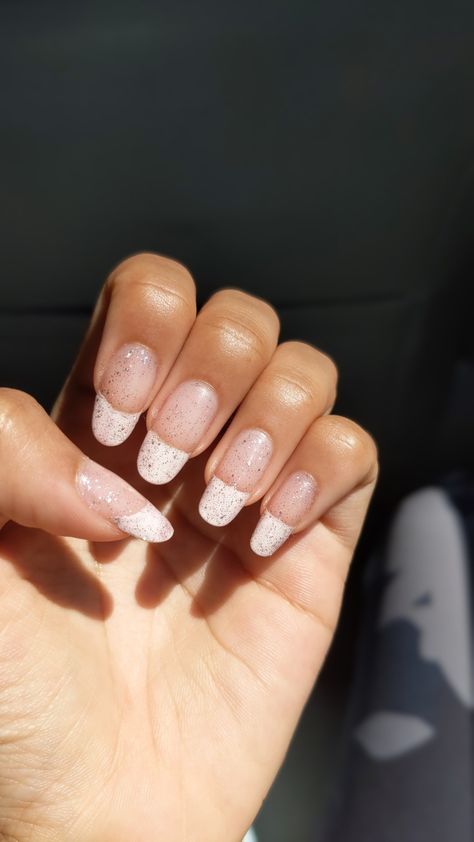 A hand with with white tips on nails and glitter on top. French Tip Glitter Top Coat, French Tip Nails With Glitter Top Coat, Glittery French Nails, White Frenchies, Glitter French Tips, Glitter Top, French Tip Nails, Nude Nails, Natural Look