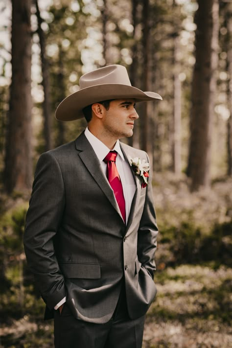 Gray and burgundy groom suit with cowboy hat Groom Suit Country Wedding, Cowboy Hats For Wedding, Gray Cowboy Hat Outfit, Suits With Cowboy Hats, Cowboy Hat With Suit, Groom Suit Cowboy, Wedding Suits Country, Groomsmen Cowboy Hats, Cowboy Wedding Suit