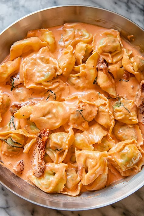 Quick and easy tortellini with sun dried tomatoes in cream sauce. Tortellini With Sun Dried Tomatoes, Tortellini Soup With Sun Dried Tomatoes, Creamy Tomato Tortellini Pasta, Sun Dried Tomato Tortellini, Cheese Tortellini Appetizer Recipes, Sun Dried Tomato Vodka Sauce, Tortellini Recipes Sun Dried Tomatoes, Sundried Tomato Artichoke Pasta, Marinara Cream Sauce