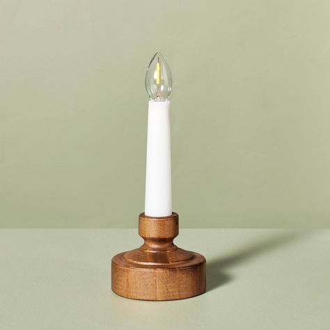 Add gentle illumination to your holiday display with this Flameless Christmas Window Candle with Faux Wood Base from Hearth & Hand™ with Magnolia. This white Christmas candle features a faux wooden base for a touch of elegance, and the warm glow adds a festive touch without the worry of flames. Measuring 7.35 inches high, it's perfect for creating a warm, cozy ambiance throughout the season. Hearth & Hand™ with Magnolia: Gather • Create • Enjoy