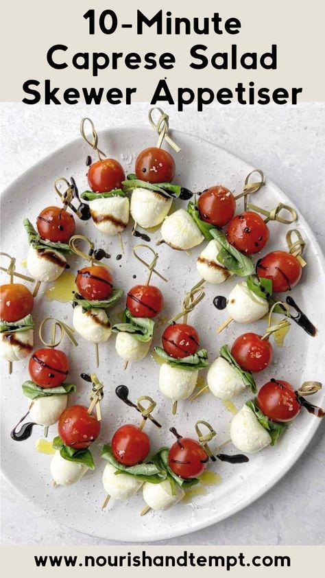 A birds eye view of caprese salad skewers drizzled with olive oil and balsamic glaze Caprese Appetizers Sticks, Wedding Luncheon Ideas, Caprese Salad Appetizer, Caprese Salad Bites, Italian Caprese, Italian Caprese Salad, Caprese Appetizer, Caprese Salad Skewers, Toothpick Appetizers