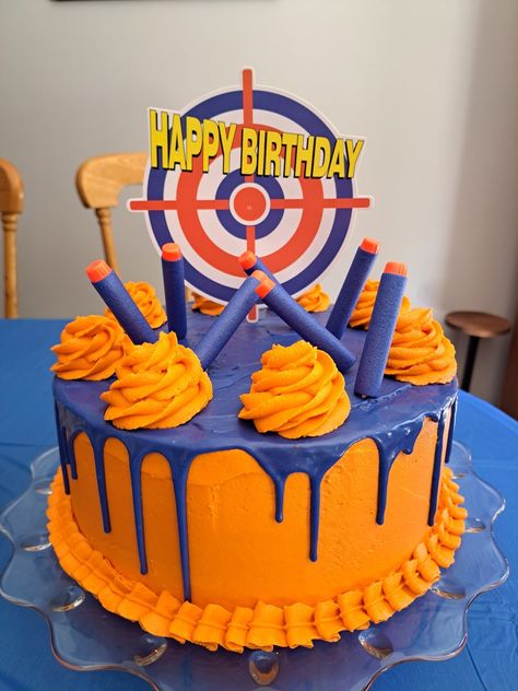 Nerf birthday cake with candy-melt ganache drip Nerf Birthday Cake, Nerf Birthday Party Ideas, Nerf Cake, Ganache Drip, Candy Melt, 11 Birthday, Nerf Birthday Party, Nerf Party, 11th Birthday