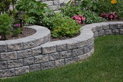 Stack Stone | Landscape Blocks | Patio Walls | Shaw Brick Corner Of Patio Ideas, Short Garden Wall Ideas, Front Yard Post Ideas, Brick Paver Garden Edging, Flower Bed Retaining Wall On A Slope, Stone Wall Garden Flower Beds, Landscaping Bricks Edging, Landscaping Wall Ideas, Garden Walls Ideas