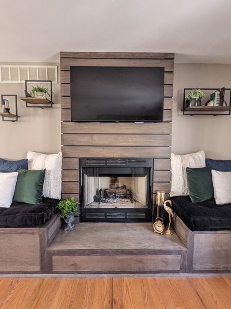 Poplar wrapped wood fireplace with bench seating. Fireplace Bench Seating Built Ins, Fireplace With Benches On Each Side, Fireplace Bench Seating, Fireplace With Bench Seating, Bench Under Tv, Wrapped Fireplace, Fireplace With Seating, Fireplace With Bench, Bench Fireplace