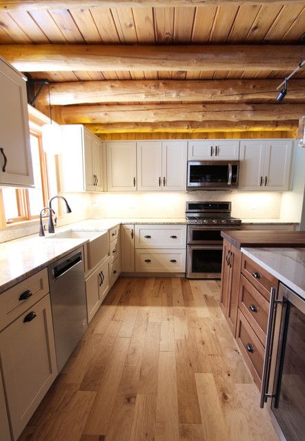 Cabin Kitchen White Cabinets, Log Cabin Update Renovation, Rustic White Kitchen Cabinets, Modern Log Cabin Kitchen, Log Cabin Kitchens Cabinets, Rustic White Kitchen, Cabin Cabinets, White Kitchen Cabinets With Granite, Log Ceiling