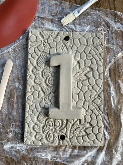 Hand Built B*tches | Made a few new house number signs | Facebook Clay House Number Plaque, House Number Plate, Pottery House Numbers, House Number Tiles, Ceramic Sign, Creative House Number Ideas, Stairs And Hallway Ideas, Tile House Numbers, House Number Plates