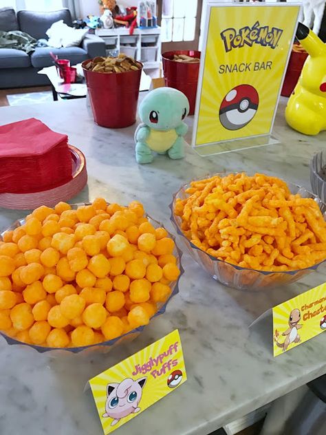 Pokémon snack bar for a Pokémon-themed birthday party. Click or visit FabEveryday.com to see details and DIY instructions for a Pokémon or Pokémon Go themed kid's party, including printables, food, decorations, favors, and party activities. Pokemon Party Food, Diy Pokemon Party, Pokemon Birthday Party Ideas, Pokemon Snacks, Diy Pokemon, Pokemon Themed Party, Food Decorations, Pokemon Birthday Party, Party Food Ideas