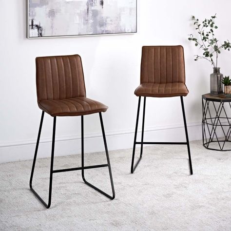 The sylish York Bar Stool with its faux tan leather upholstered seat makes a modern addition thats perfect for positioning at a breakfast bar. Its design will fit nicely into a variety of different home decor styles. Also available in Grey. Dimensions:... Breakfast Bar Kitchen Island, Kitchen Island Stools, Stools Kitchen Island, Bar Kitchen Island, Different Home Decor, Different Home Decor Styles, Bar Stools Kitchen, Velvet Footstool, Island Stools