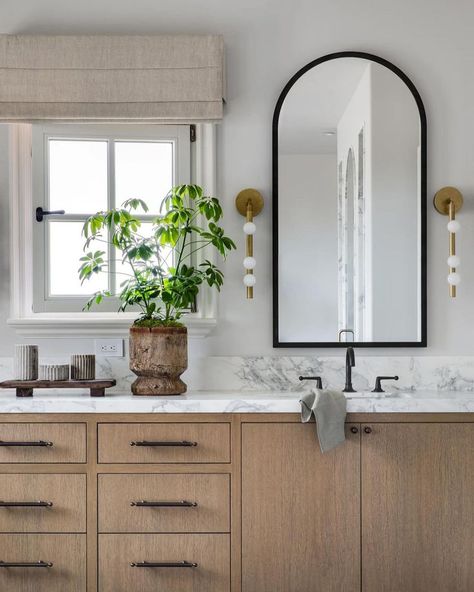 Bathroom Design | Design by Brooke Wagner Designs | Modern Bathroom with bathroom vanity and gold sconces, and a marble sink Arched Hallway, Mcgee Bathroom, Black Arch Mirror, Lake Bathroom, Brooke Wagner Design, Moody Bathroom, Brooke Wagner, Condo Bathroom, Mixing Metals