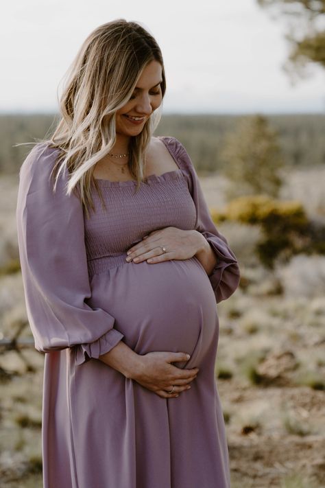 Maternity dress for photography, soft lavender purple maxi dress with minimal ruffles, scenic Bend Oregon photography location Flowy Maternity Dress Photo Shoot, Flowy Dress Maternity Shoot, Lavender Maternity Dress Photoshoot, Lavender Maternity Dress, Winter Maternity Dress, Lilac Maternity Dress Photoshoot, Flowy Maternity Dress, Diy Maternity Photos, Wearing Purple