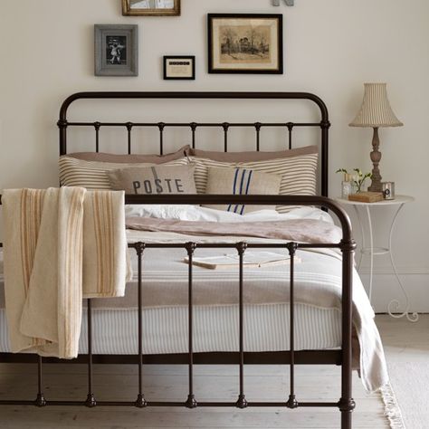 Neutral country bedroom with iron bed | country decorating ideas | Country Homes & Interiors | Housetohome.co.uk Modern Farmhouse Bedroom Decor, Cottage Style Bedroom, Vintage Bedroom Styles, Wrought Iron Beds, Wrought Iron Bed, Farmhouse Bedroom Decor Ideas, Iron Beds, Farmhouse Style Bedrooms, Iron Bed Frame