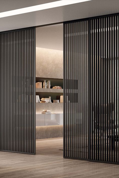 A concept that recalls the cinetic art of the seventies. The dense vertical strips texture creates a solid and light wall at the same time. Click on the pin to find out more! Sliding Divider, Loft Door, Dubai Houses, Door Stripping, Balcony Planters, Wardrobe Door Designs, Doors Interior Modern, Villa Plan, Glass And Aluminium